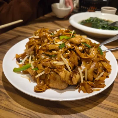Stir-fried ho fun rice noodles with wok-hay at Trithis Chinese restaurant in Mississauga